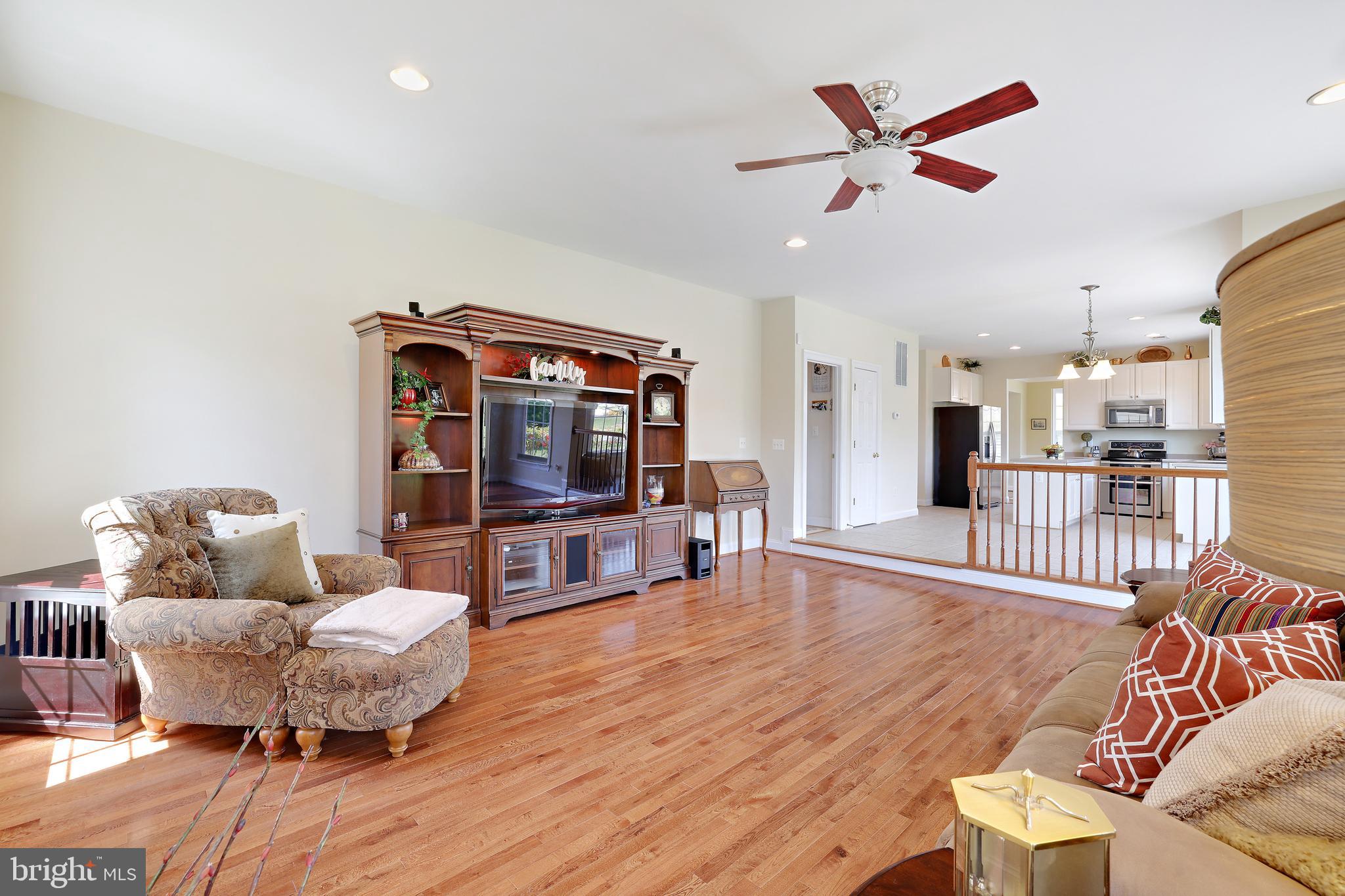 8301 Banister Road Severn, MD 21144 - Photo 24 of 57 a living room with furniture and a flat screen tv