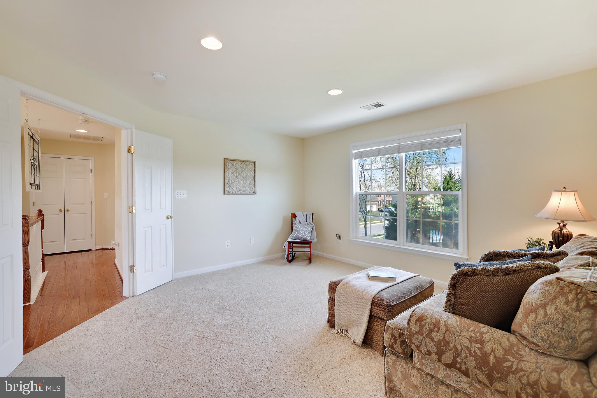 8301 Banister Road Severn, MD 21144 - Photo 32 of 57 a living room with furniture and a large window