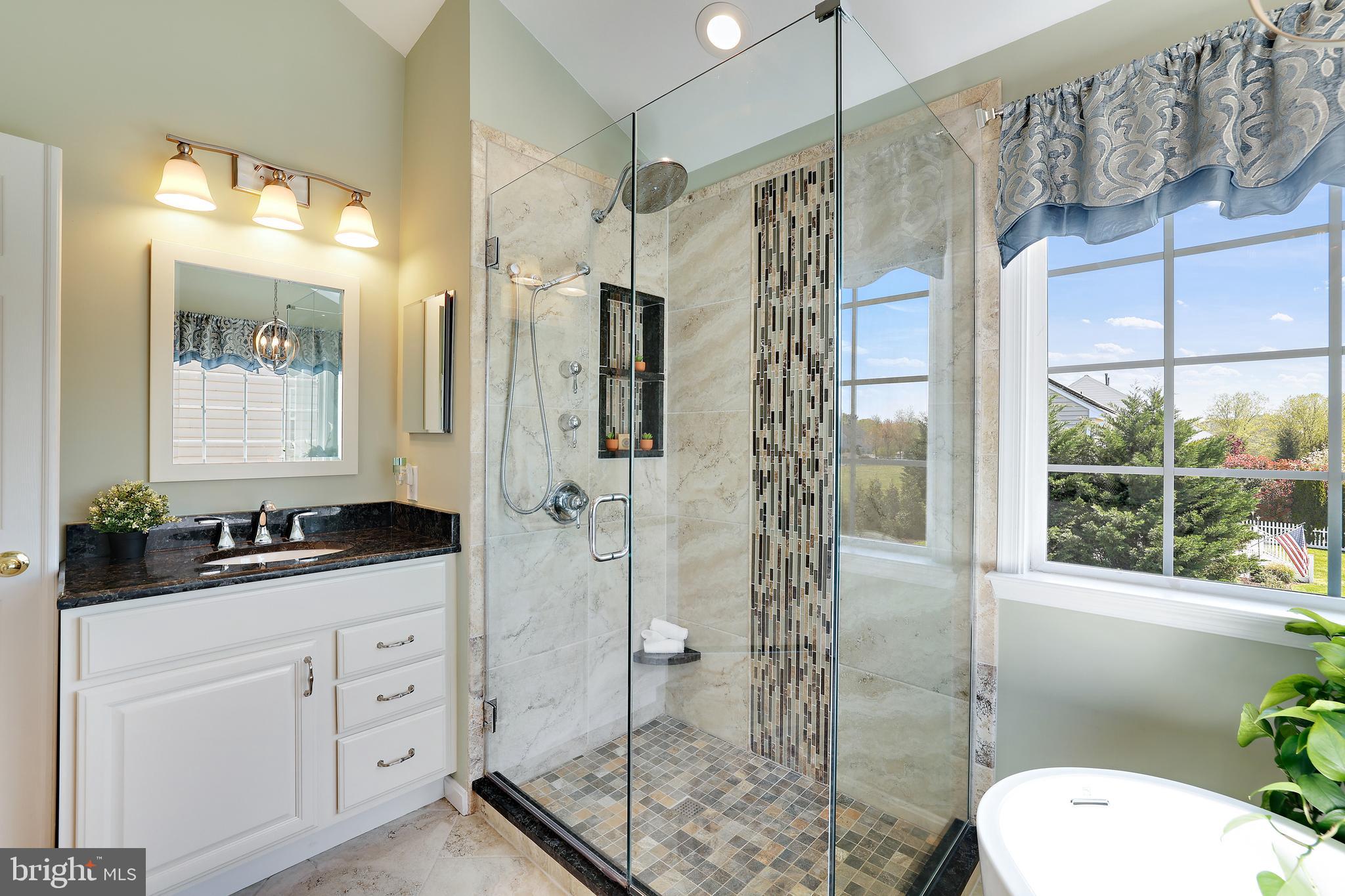 8301 Banister Road Severn, MD 21144 - Photo 35 of 57 a bathroom with a granite countertop sink toilet mirror and shower