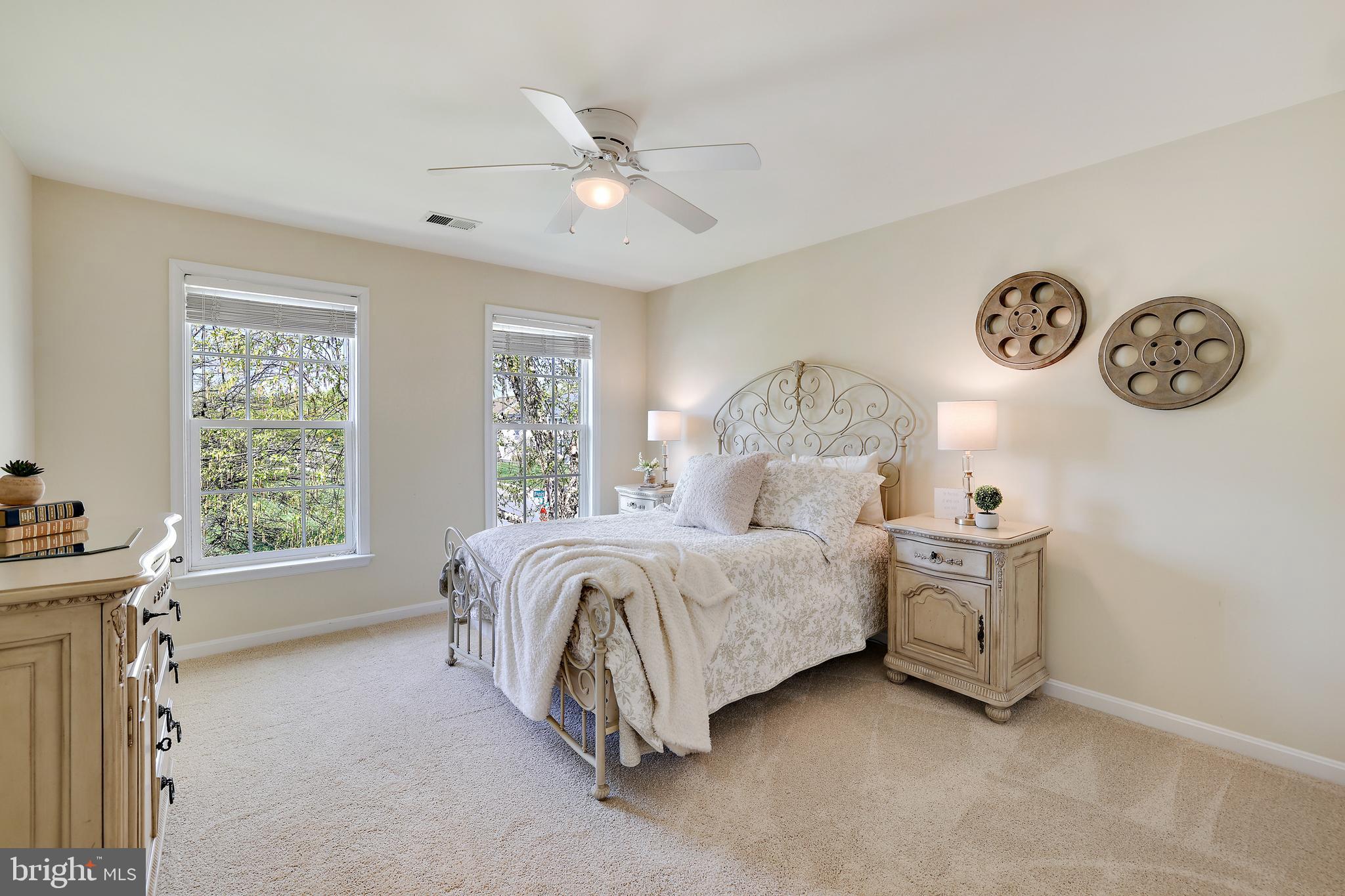 8301 Banister Road Severn, MD 21144 - Photo 40 of 57 a spacious bedroom with a bed and a window