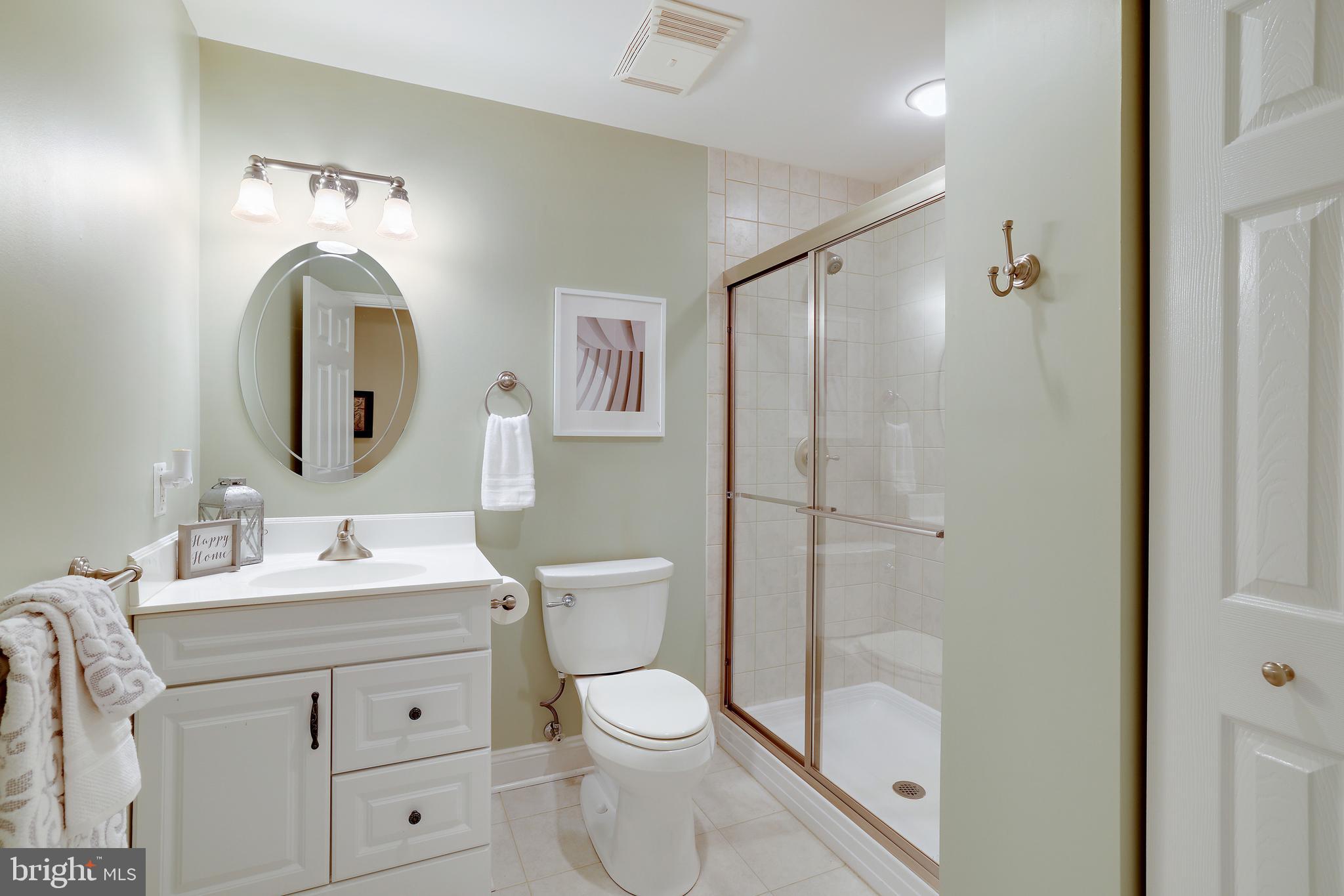 8301 Banister Road Severn, MD 21144 - Photo 45 of 57 a bathroom with a toilet sink and shower