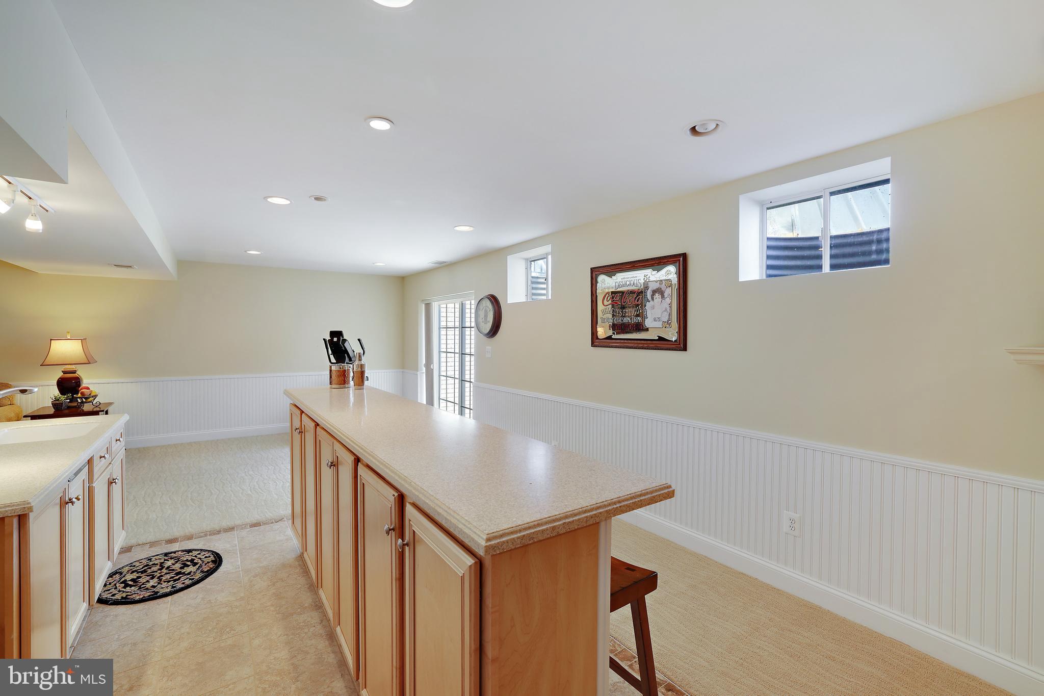 8301 Banister Road Severn, MD 21144 - Photo 48 of 57 a view of a livingroom with furniture and a kitchen