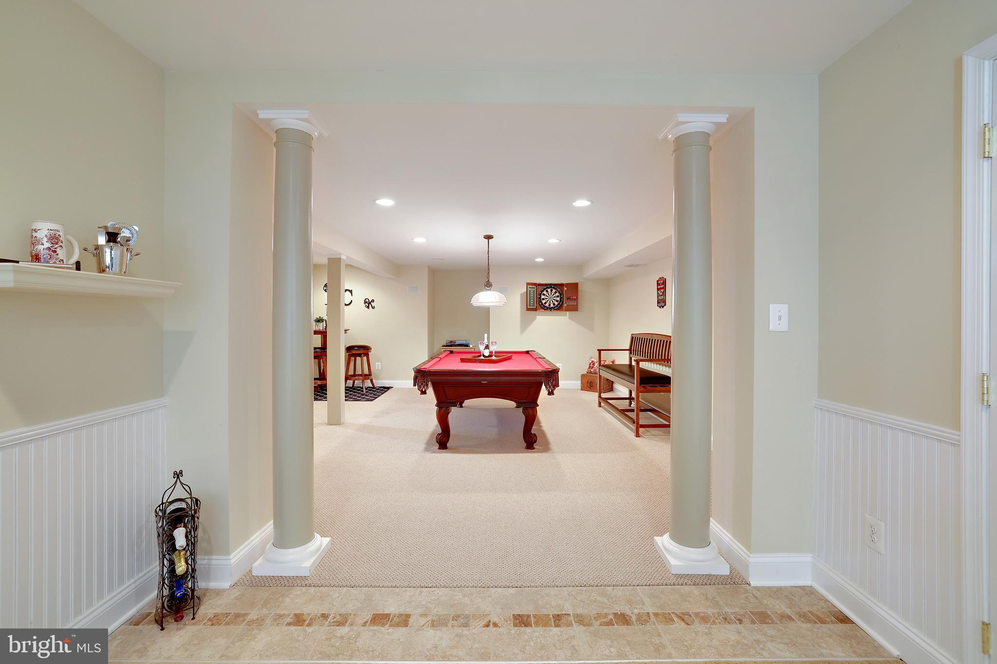 8301 Banister Road Severn, MD 21144 - Photo 49 of 57 a living room with furniture and a mirror