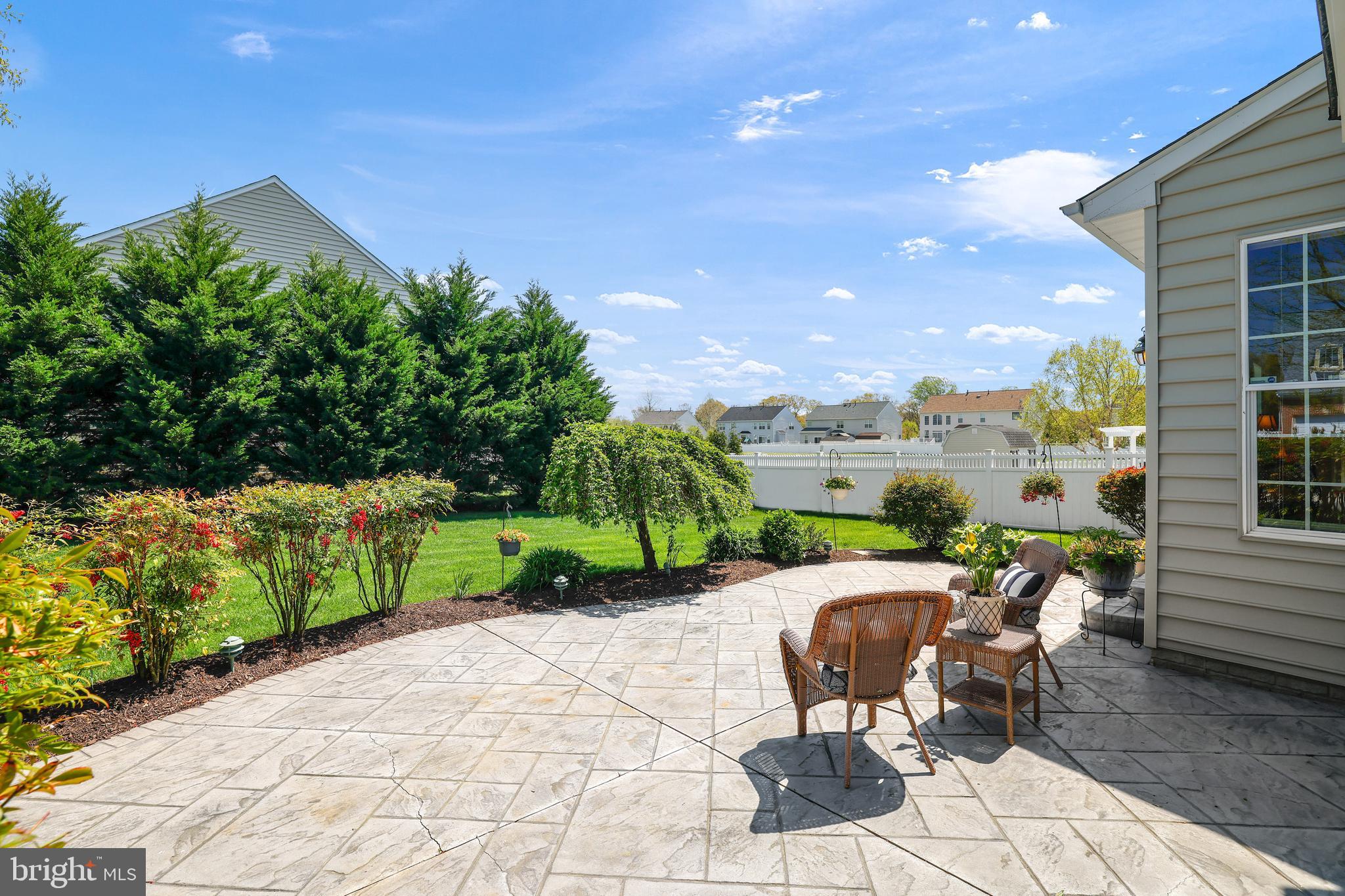 8301 Banister Road Severn, MD 21144 - Photo 10 of 57 a view of a patio with table and chairs and potted plants