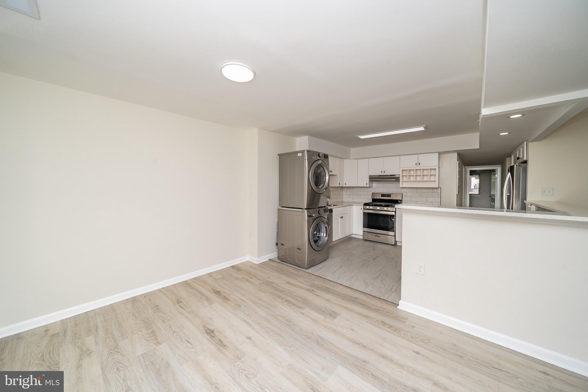 9910 Walker House Road, Unit 99104 Gaithersburg, MD 20886 - Photo 10 of 32 a view of a kitchen with wooden floor