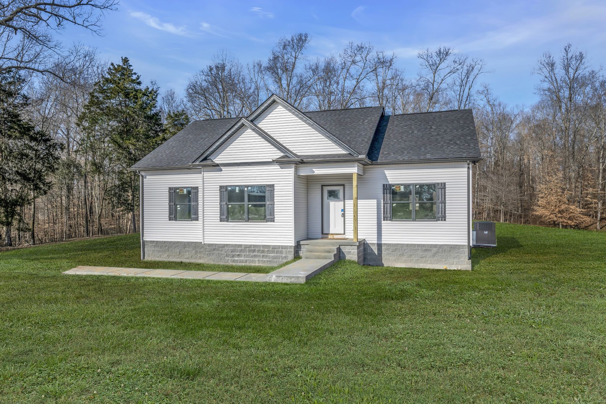 1069 Old County House Road Charlotte, TN 37036 - Photo 35 of 43 Covered Front Porch + Concrete Sidewalk Note: Green grass edits on exterior photos