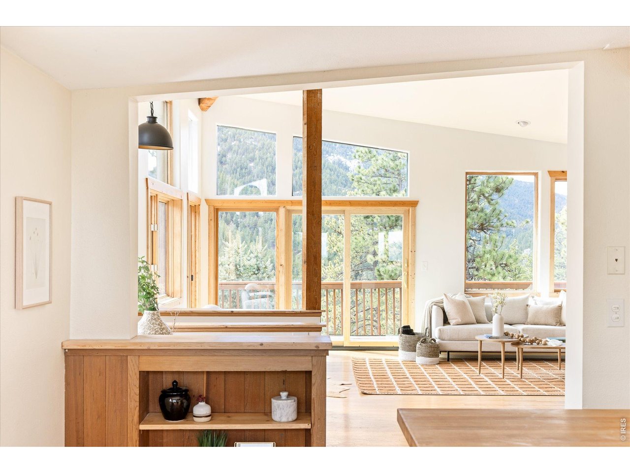 187 Nugget Hill Road Jamestown, CO 80455 - Photo 11 of 34 a living room with a couch and a large window