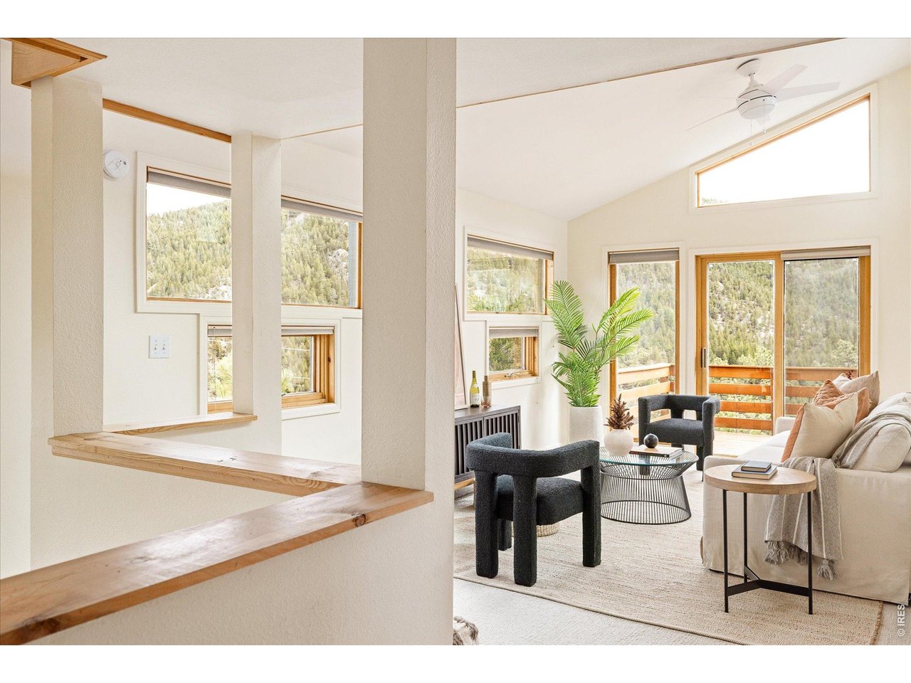 187 Nugget Hill Road Jamestown, CO 80455 - Photo 18 of 34 a living room with furniture and large windows