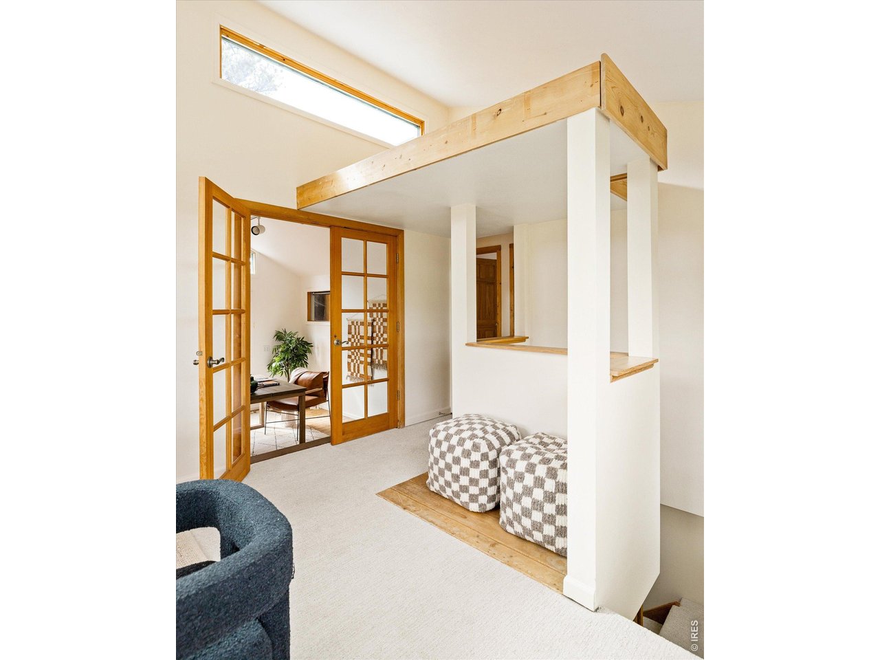 187 Nugget Hill Road Jamestown, CO 80455 - Photo 19 of 34 a living room with furniture and a floor to ceiling window