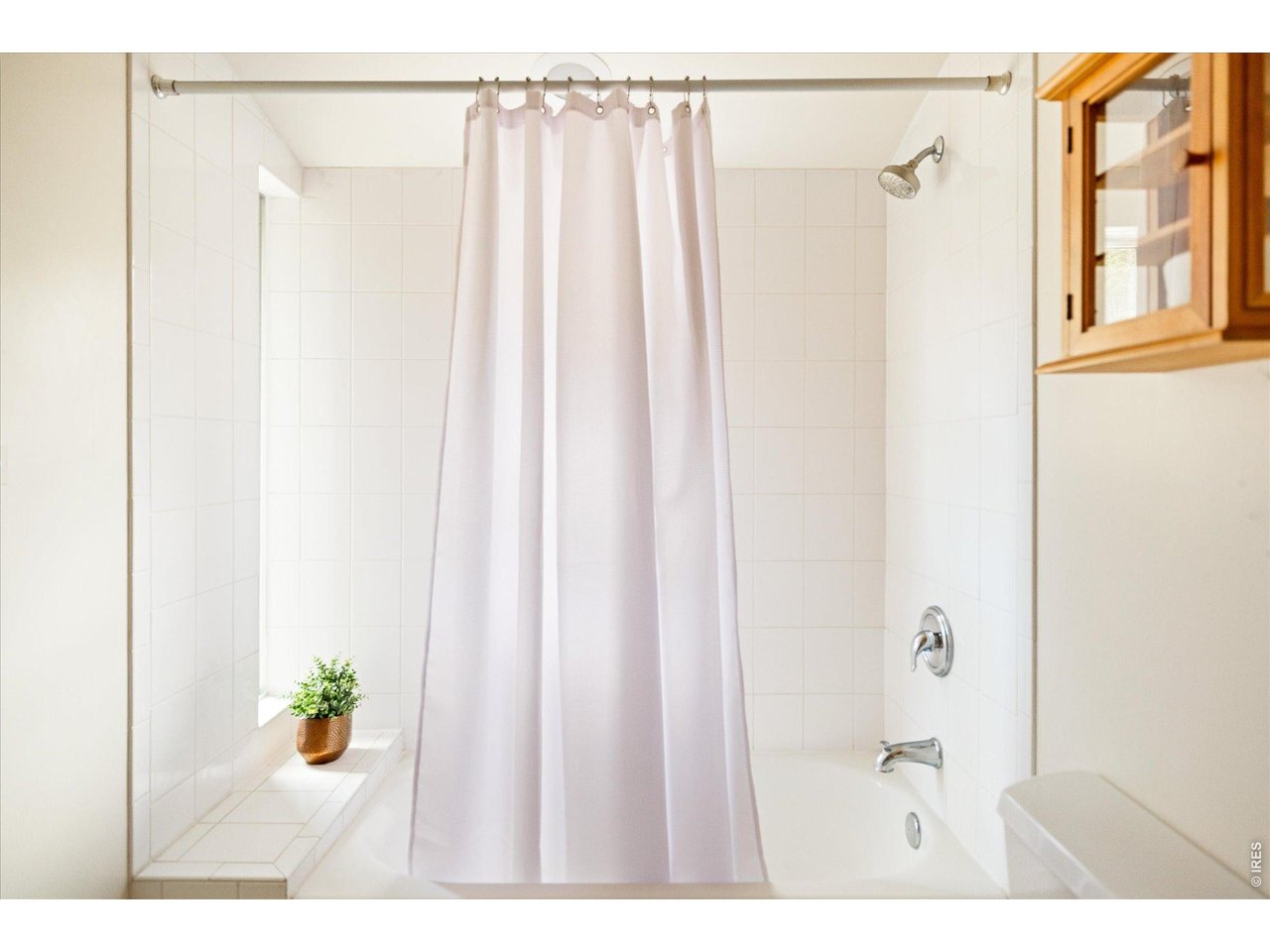 187 Nugget Hill Road Jamestown, CO 80455 - Photo 24 of 34 a view of a bathroom with a shower curtain