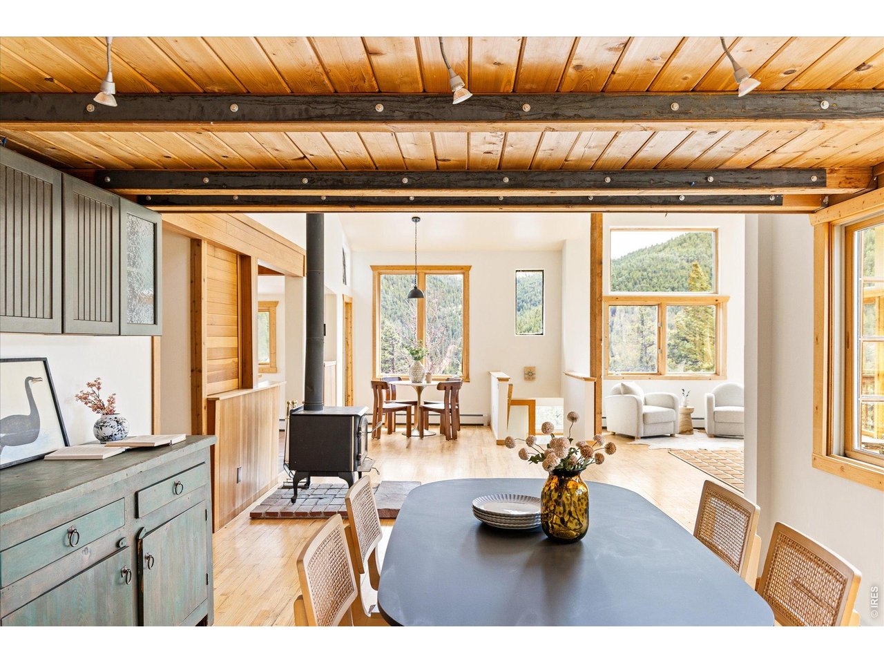 187 Nugget Hill Road Jamestown, CO 80455 - Photo 6 of 34 a living room with furniture and floor to ceiling windows