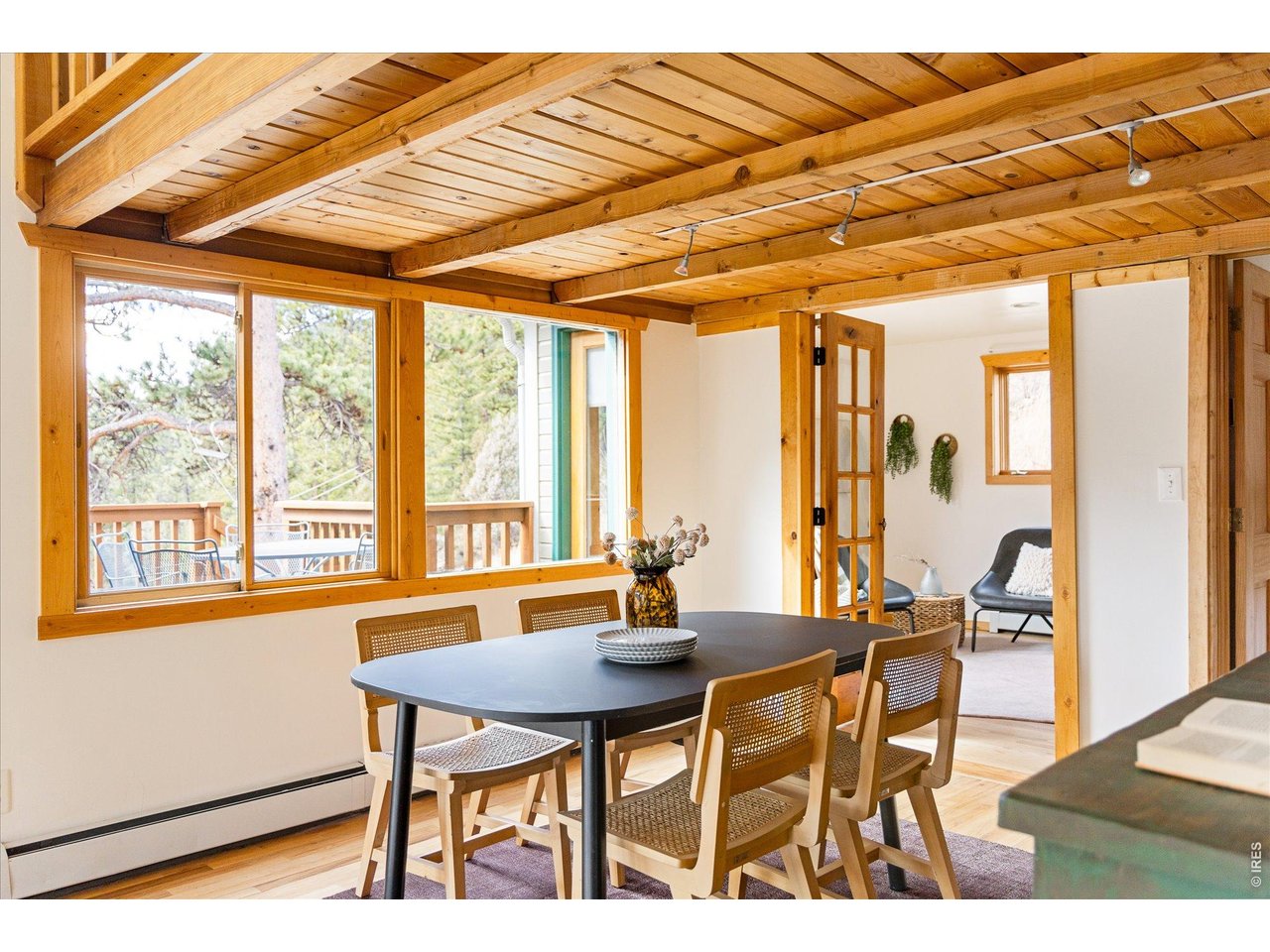 187 Nugget Hill Road Jamestown, CO 80455 - Photo 7 of 34 a dining room with furniture and wooden floor