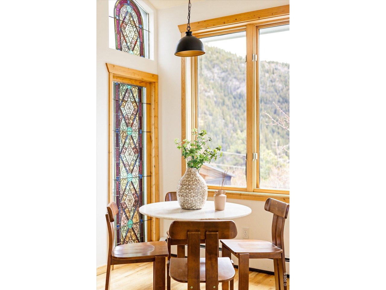 187 Nugget Hill Road Jamestown, CO 80455 - Photo 8 of 34 a view of a dining room with furniture and a window