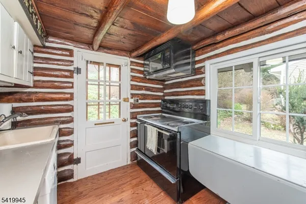 a kitchen with a stove and a sink