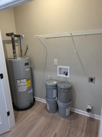 a view of a room with wooden floor and sink