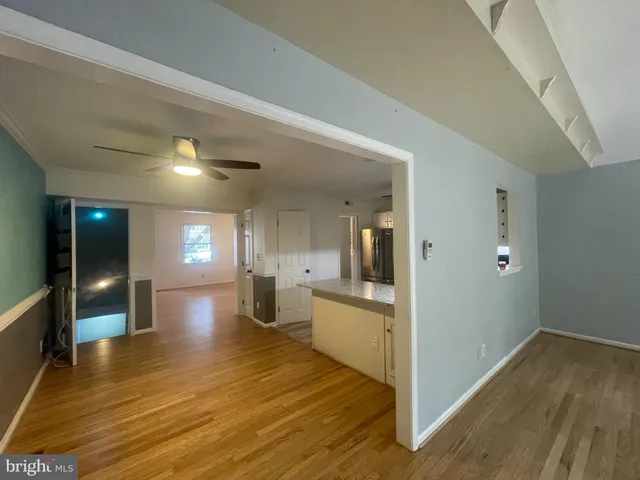 a view of a hallway with stairs