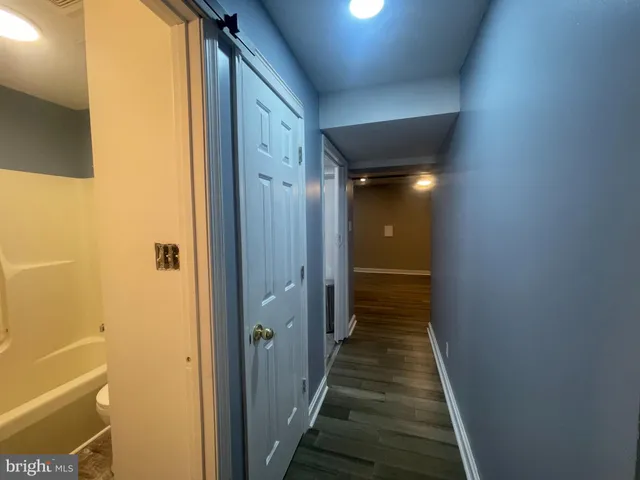 a bathroom with a bathtub and a sink