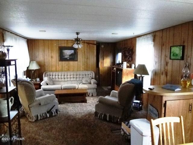 69 Salem Heights Rd Lake Lake Ariel, PA 18436 - Photo 5 of 18 a living room with furniture and a wooden floor
