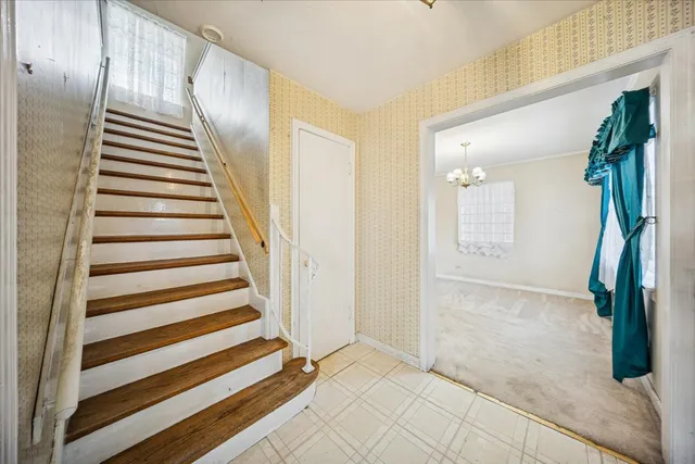a view of entryway with furniture and wooden floor
