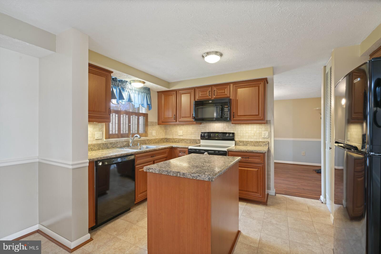 7514 Candytuft Court Springfield, VA 22153 - Photo 16 of 43 Open kitchen with island