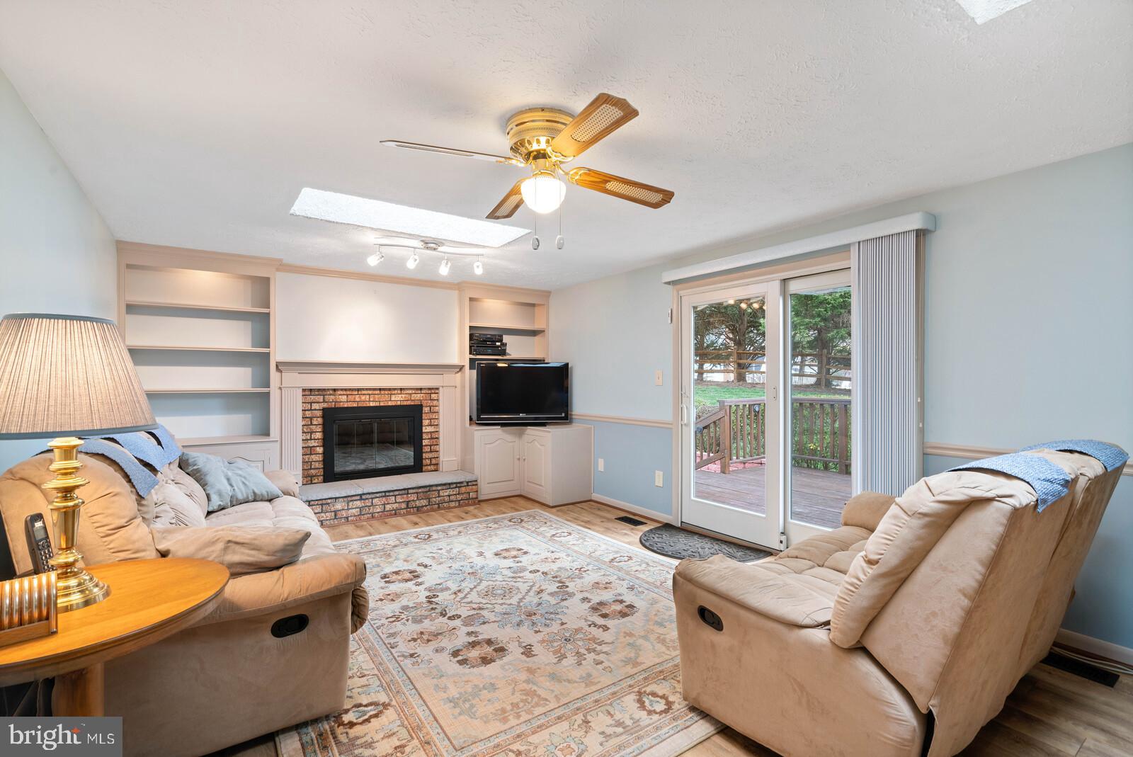 7514 Candytuft Court Springfield, VA 22153 - Photo 22 of 43 Large Family Room with cozy wood burning fireplace