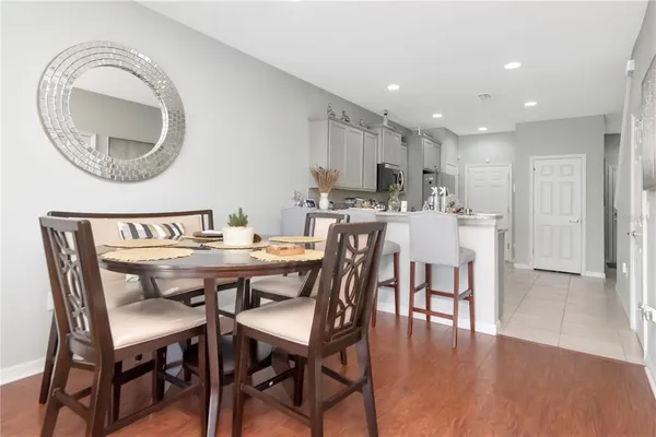a view of a dining room with furniture and wooden floor