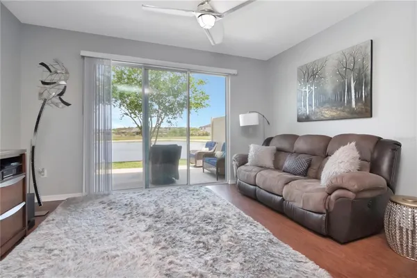 a living room with furniture and a window