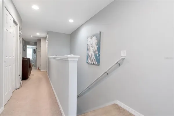 a view of a hallway with a white walls