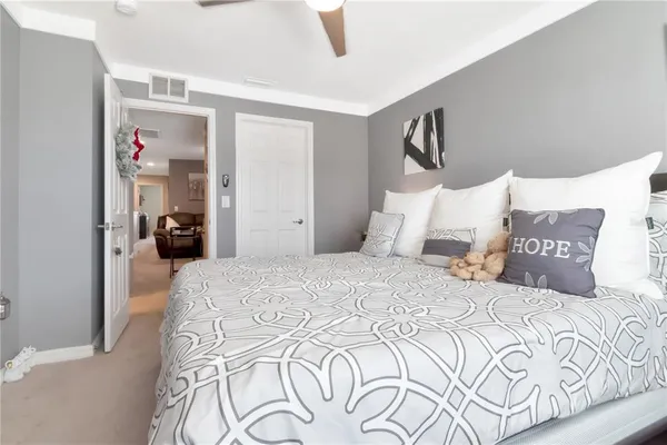 a view of a patio with couches and a potted plant on a table