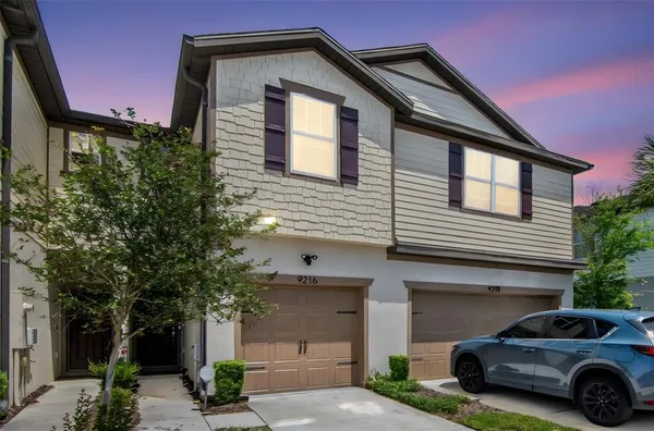 a car parked in front of a house