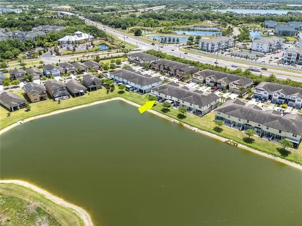 an aerial view of a city with ocean view