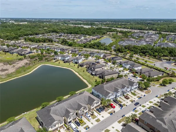 an aerial view of residential house with outdoor space and swimming pool