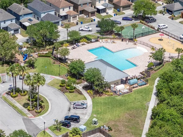an aerial view of residential houses with outdoor space