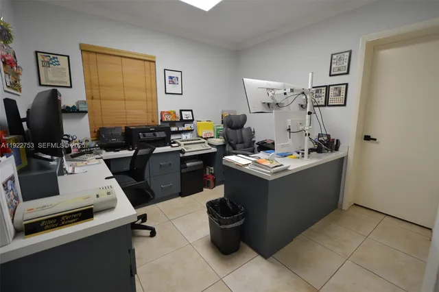 a room with a storage utility and a sink