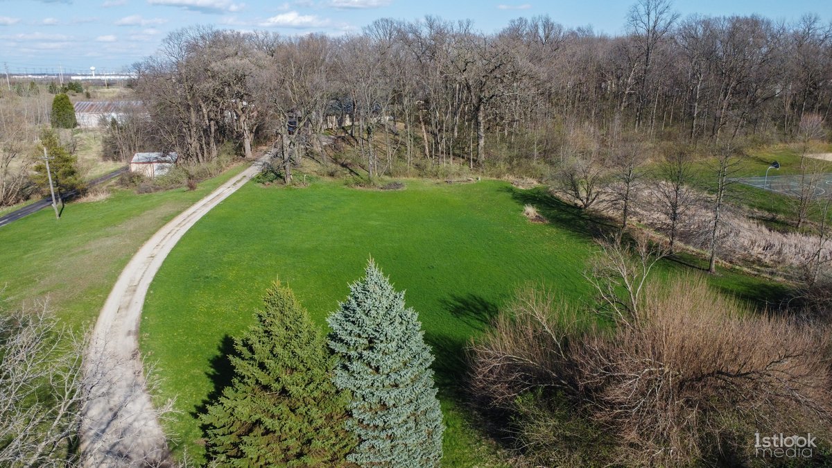 4S785 Norris Road Sugar Grove, IL 60554 - Photo 29 of 31 a view of a lake with a yard