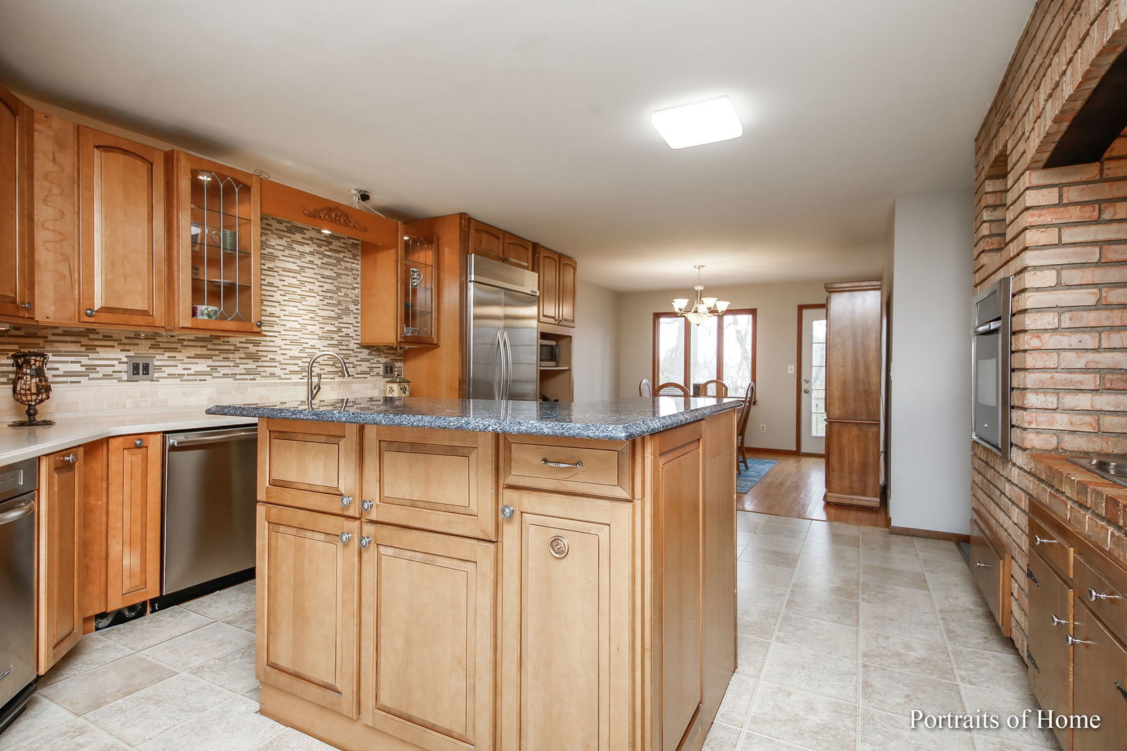 4S785 Norris Road Sugar Grove, IL 60554 - Photo 8 of 31 a kitchen with stainless steel appliances granite countertop a refrigerator a stove and a sink with cabinets