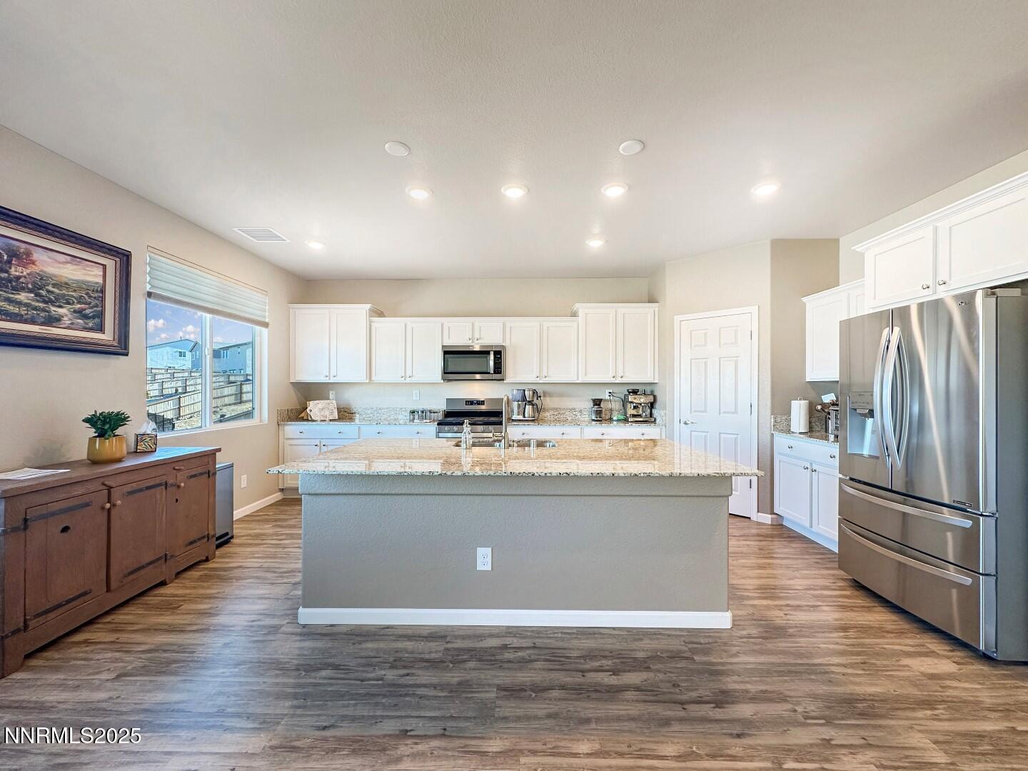 2015 Painted Sky Way Sun Valley, NV 89433 - Photo 11 of 31 a view of kitchen with stainless steel appliances granite countertop a stove and refrigerator