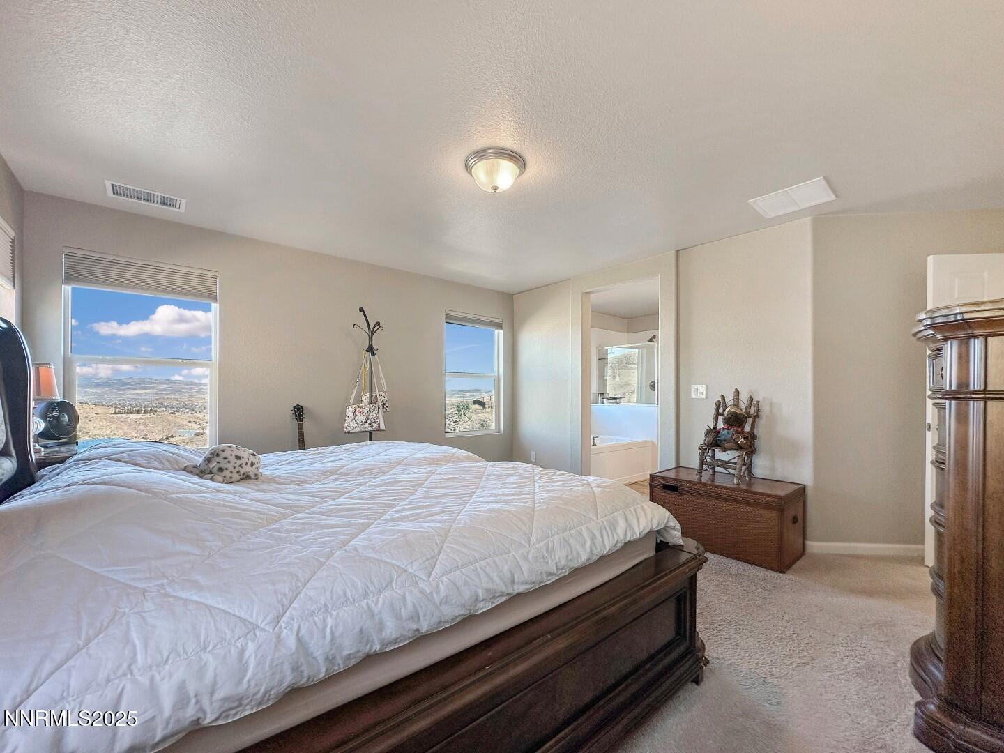 2015 Painted Sky Way Sun Valley, NV 89433 - Photo 18 of 31 a bedroom with a bed and dresser