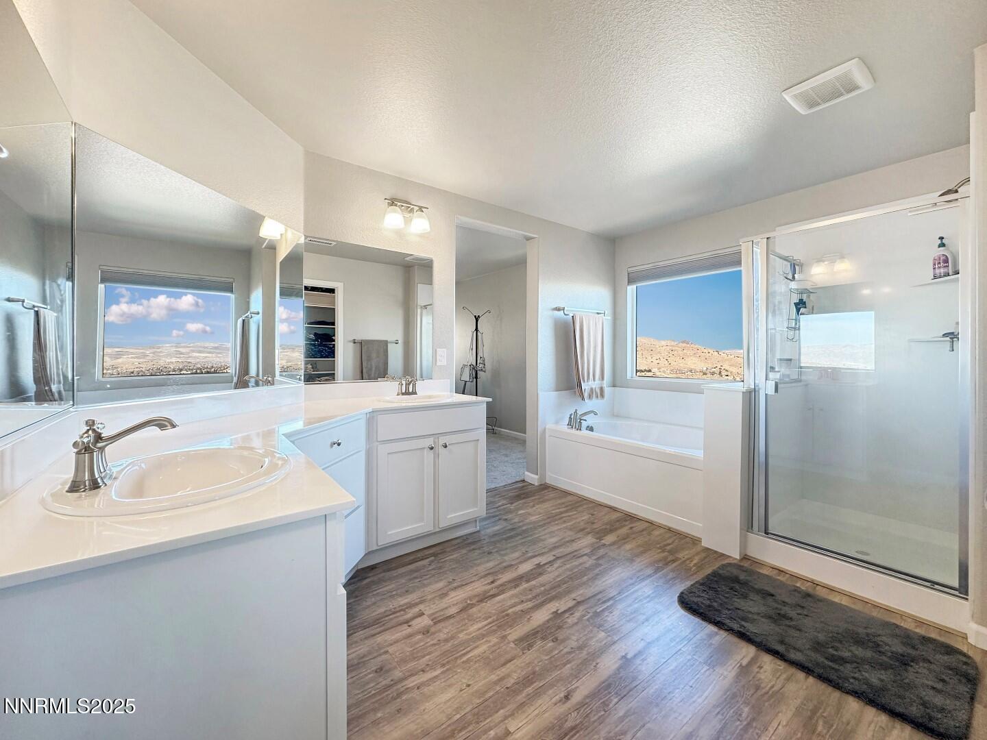 2015 Painted Sky Way Sun Valley, NV 89433 - Photo 21 of 31 a large bathroom with a glass door shower sink and mirror