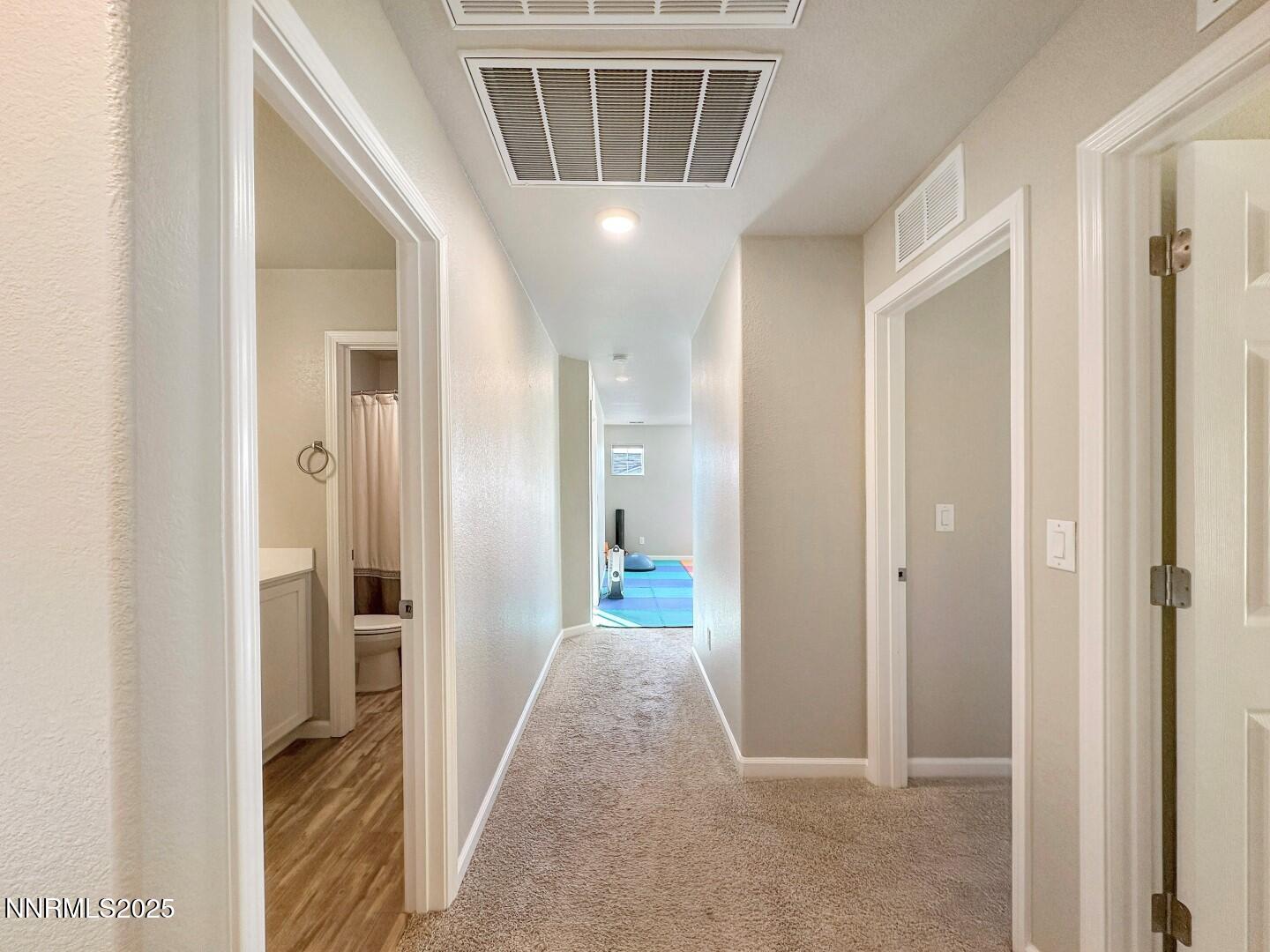 2015 Painted Sky Way Sun Valley, NV 89433 - Photo 22 of 31 a view of hallway with wooden floor