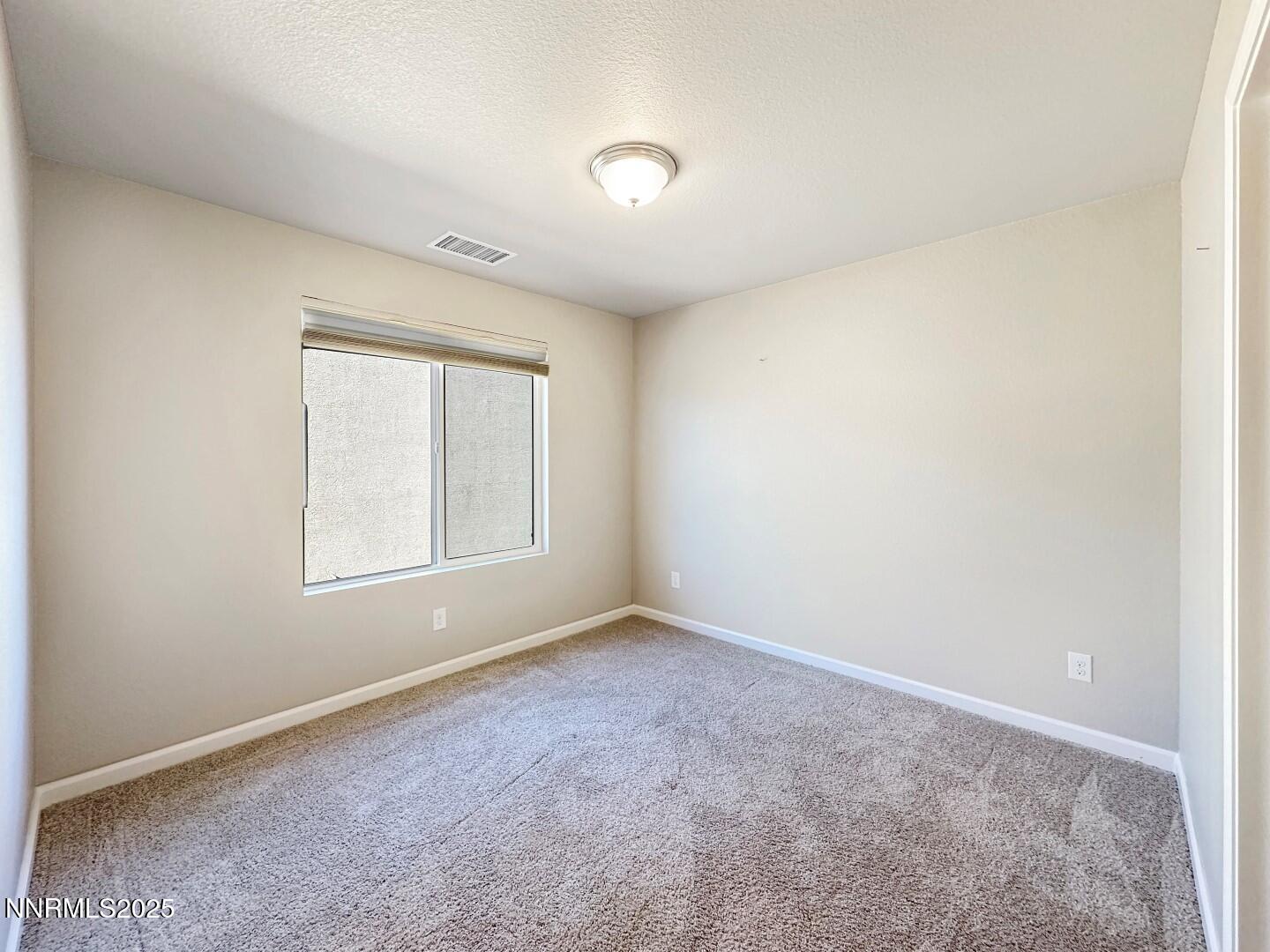 2015 Painted Sky Way Sun Valley, NV 89433 - Photo 27 of 31 an empty room with windows