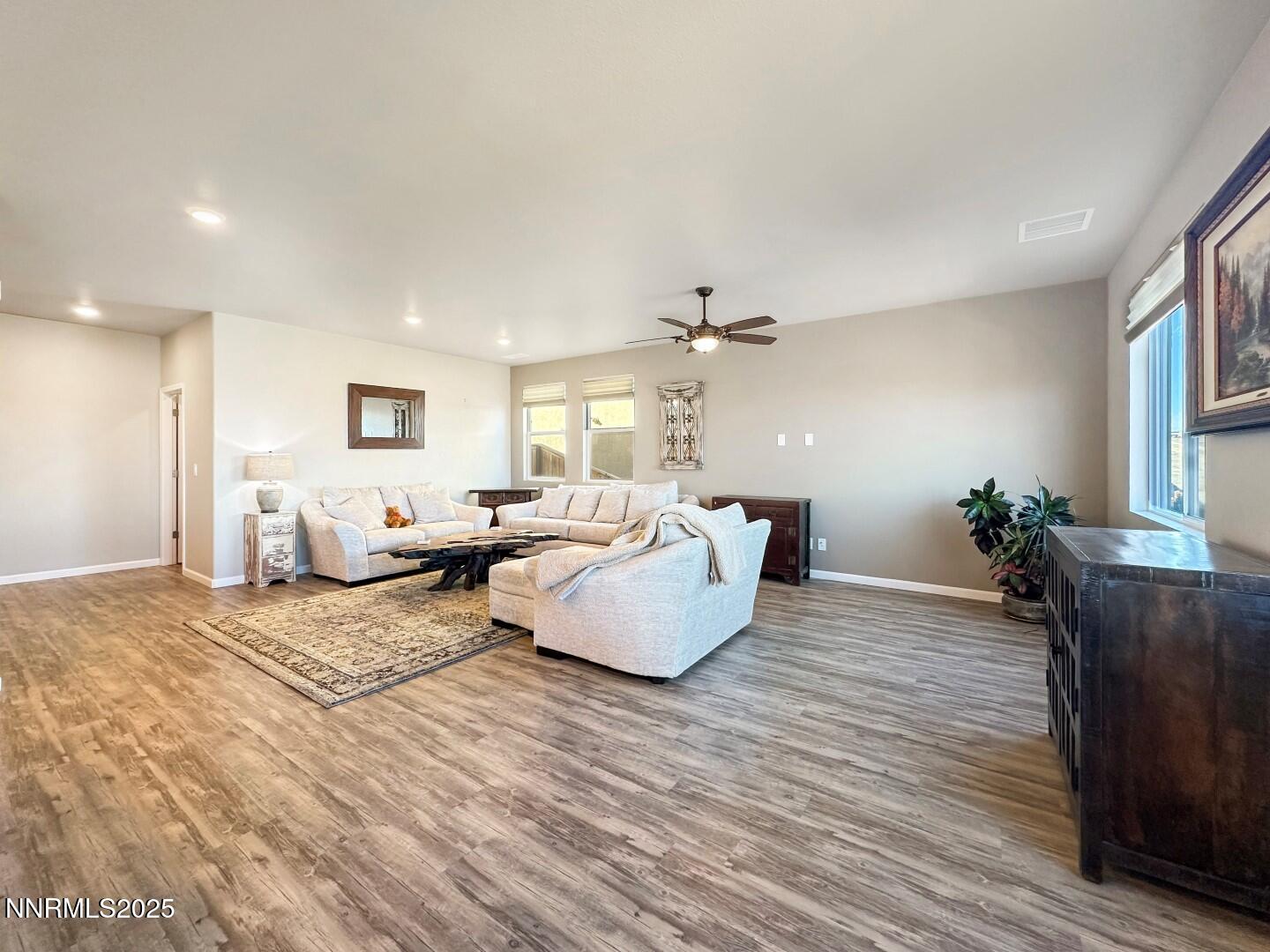 2015 Painted Sky Way Sun Valley, NV 89433 - Photo 4 of 31 a bedroom with furniture and a wooden floor