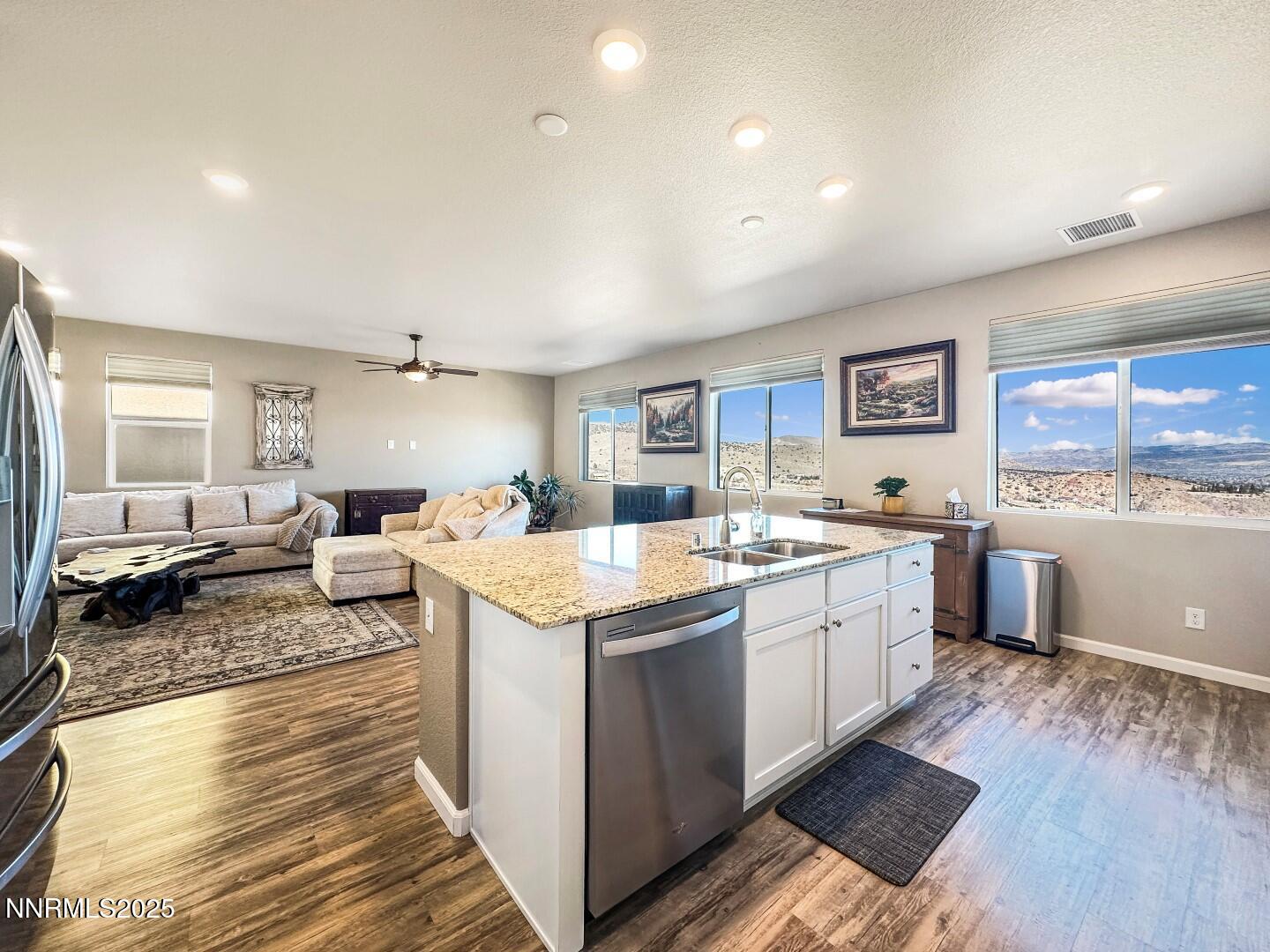 2015 Painted Sky Way Sun Valley, NV 89433 - Photo 6 of 31 a large kitchen with a lot of counter space