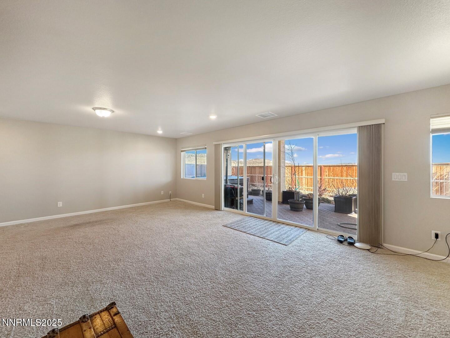 2015 Painted Sky Way Sun Valley, NV 89433 - Photo 9 of 31 a view of an empty room with glass door