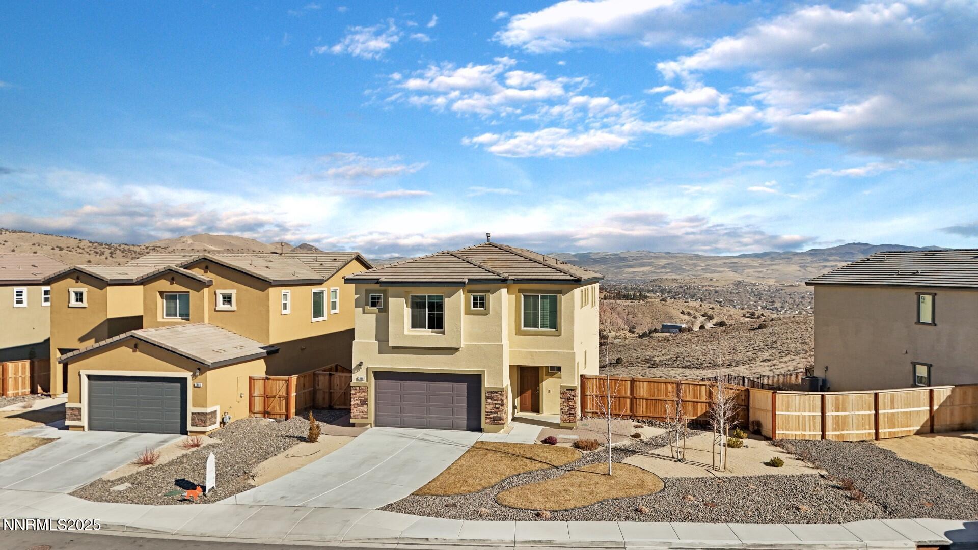 2015 Painted Sky Way Sun Valley, NV 89433 - Photo 10 of 31 a front view of a house with a yard