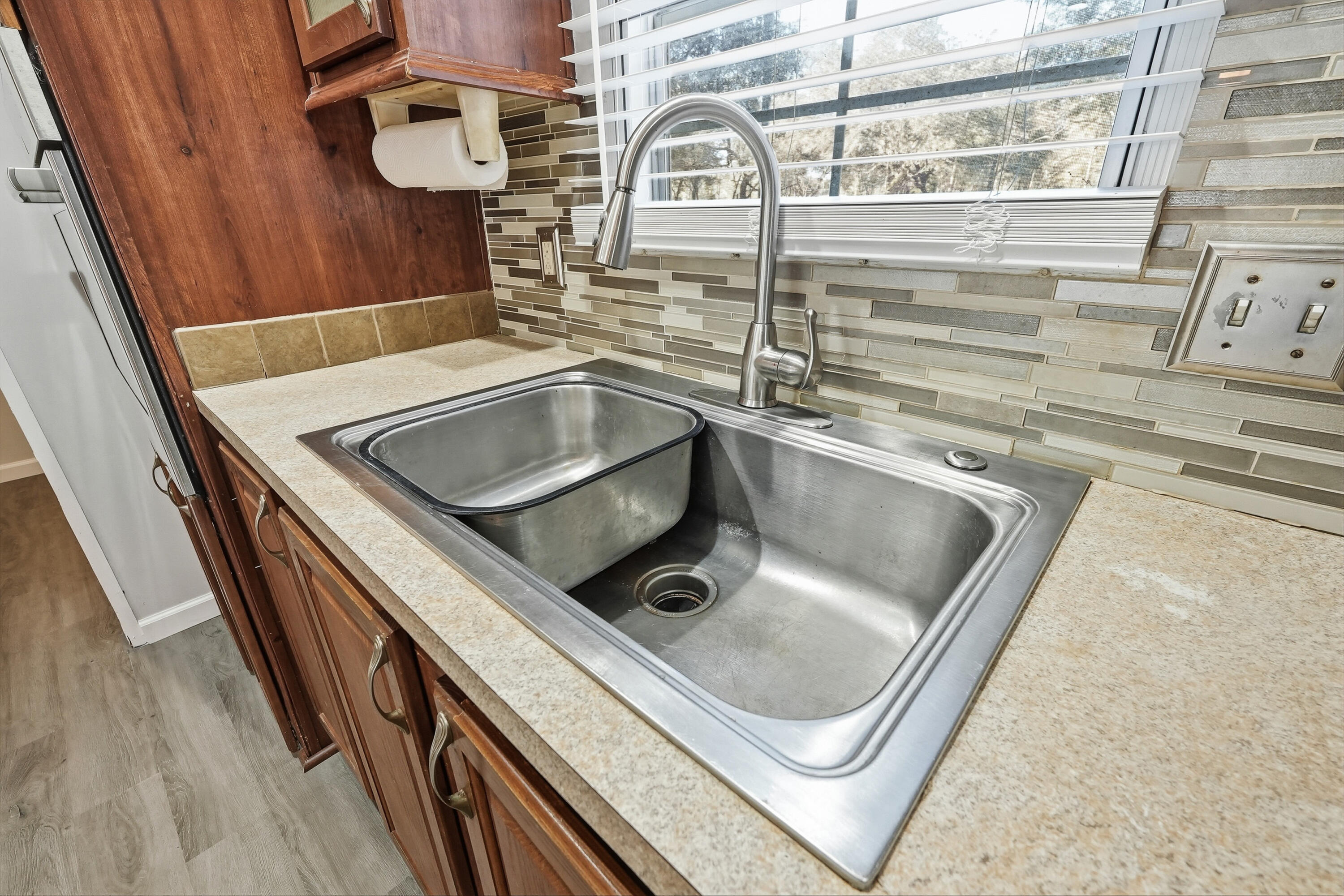 482 Roberts Road East DeFuniak Springs, FL 32433 - Photo 16 of 61 a kitchen with a sink and a stove next to a window