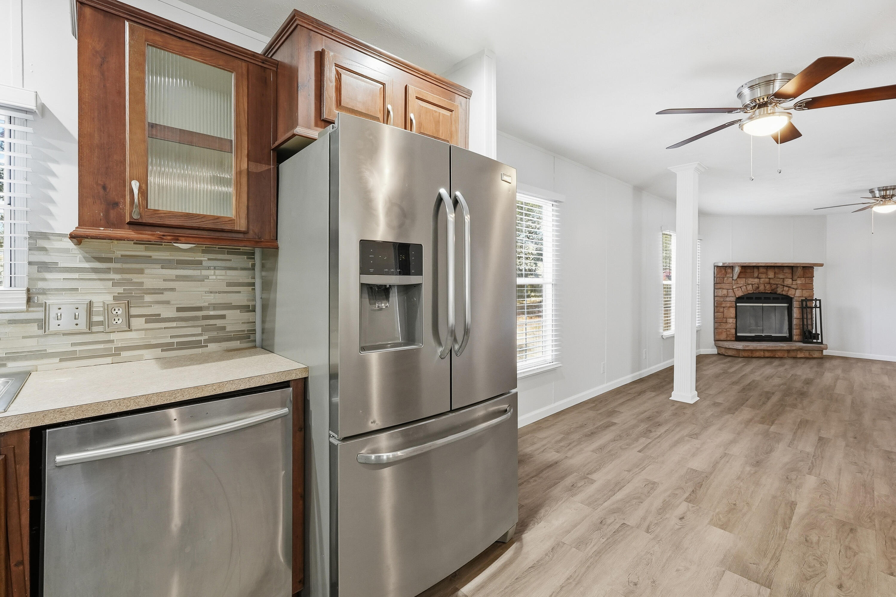 482 Roberts Road East DeFuniak Springs, FL 32433 - Photo 19 of 61 a kitchen with stainless steel appliances a refrigerator and a stove top oven