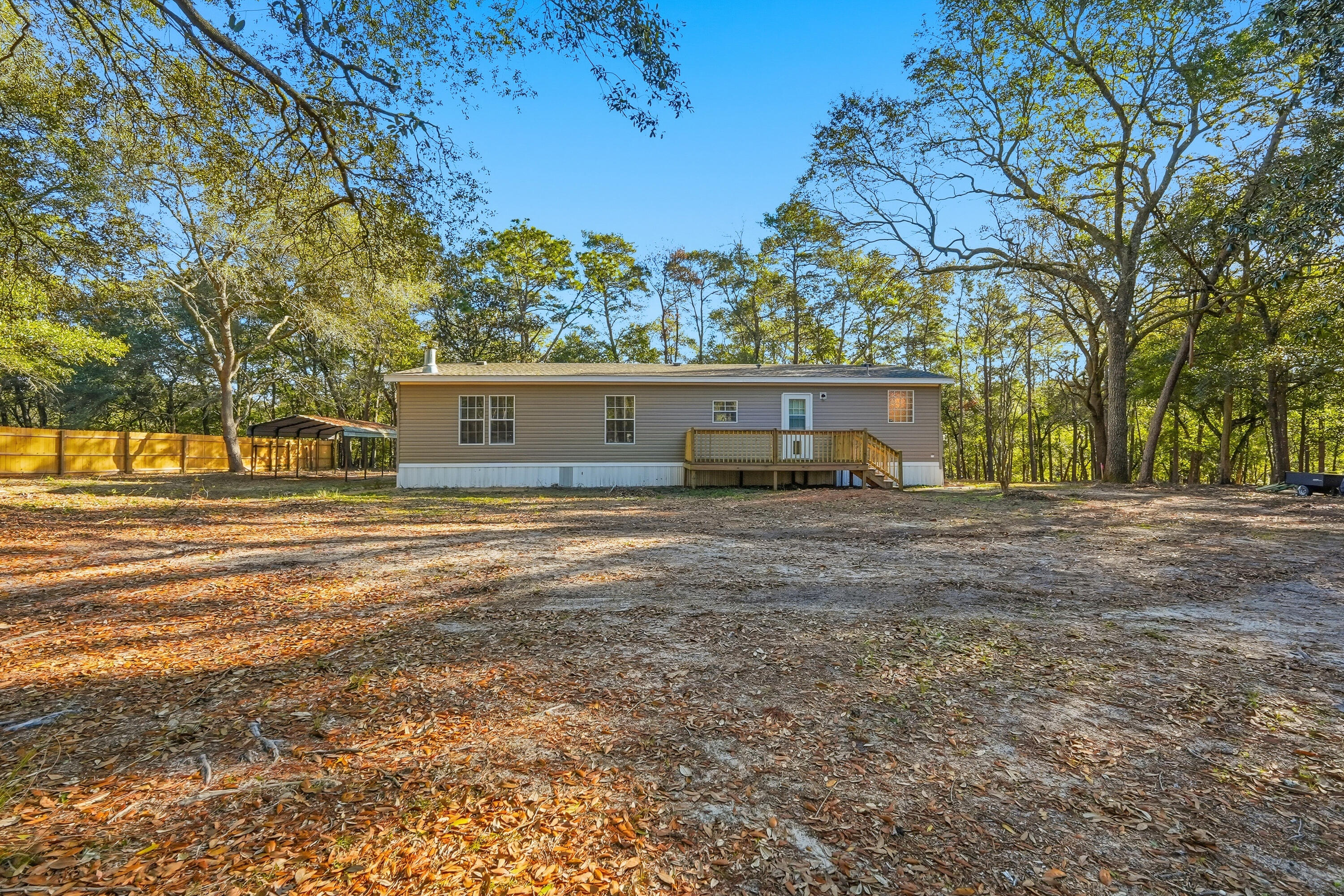 482 Roberts Road East DeFuniak Springs, FL 32433 - Photo 2 of 61 a front view of a house with a yard
