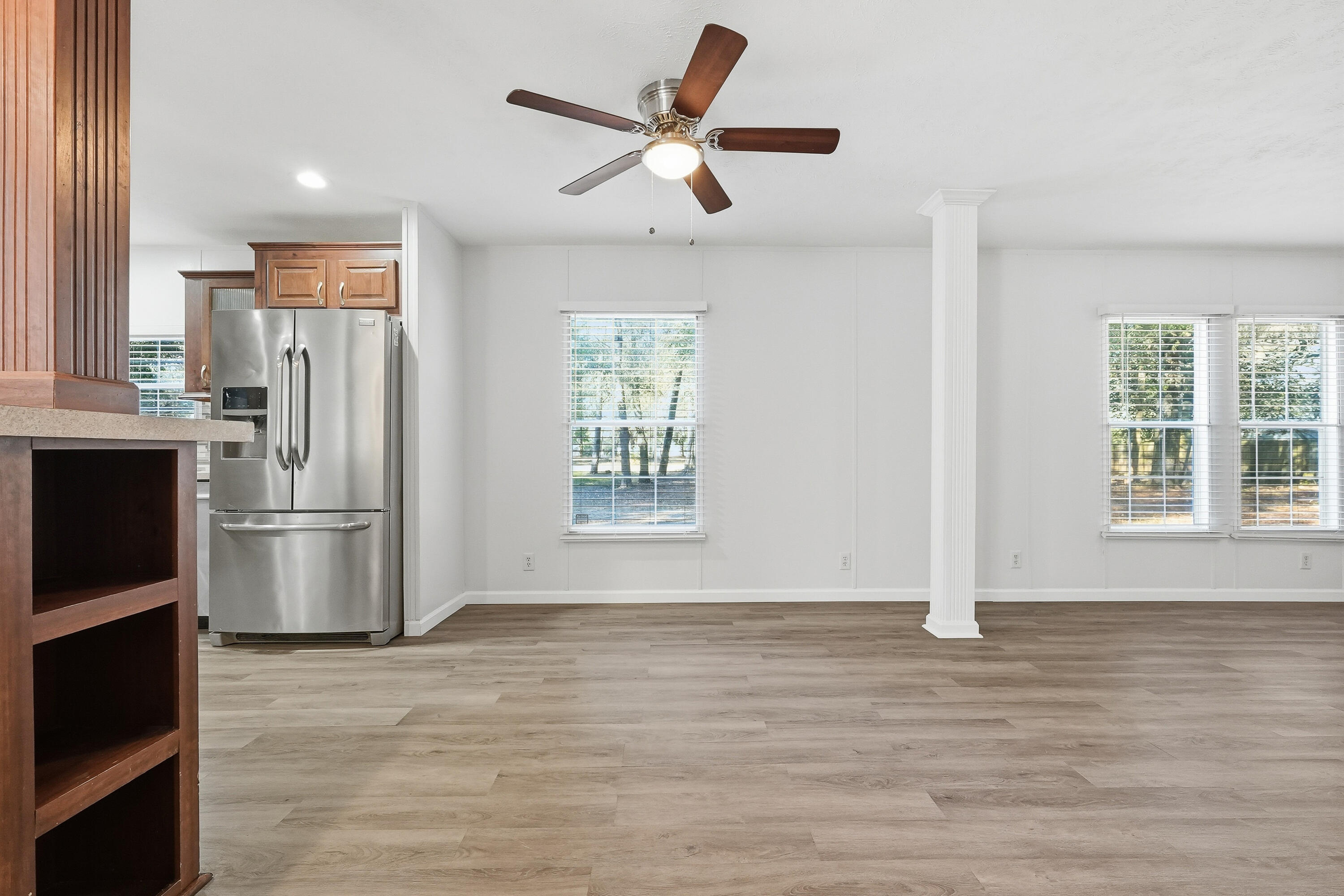 482 Roberts Road East DeFuniak Springs, FL 32433 - Photo 21 of 61 a view of a kitchen with a stove cabinets and a ceiling fan
