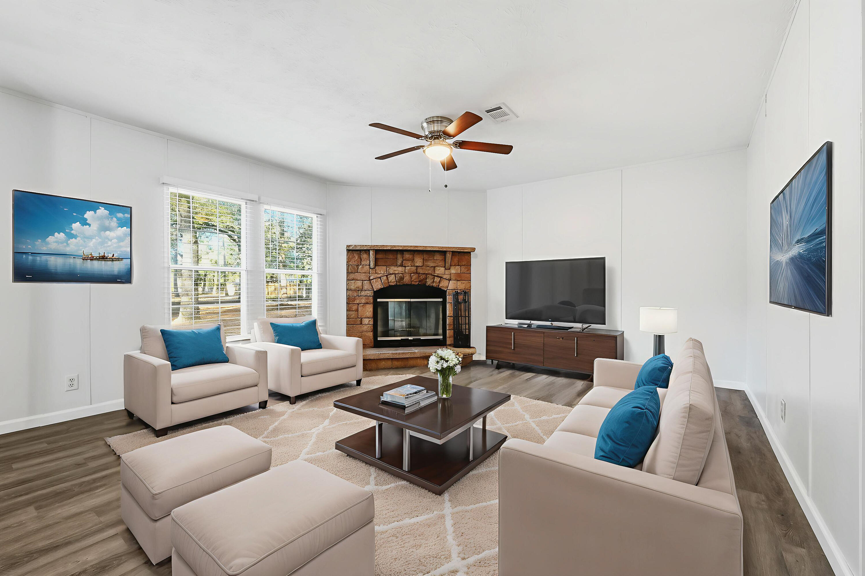 482 Roberts Road East DeFuniak Springs, FL 32433 - Photo 26 of 61 a living room with furniture and a fireplace